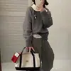 Gola Peter Pan estilo casual falso duas peças doce camada interna suéter top de tricô top de manga comprida novo estilo