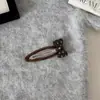 Presilha de cabelo estilo coreano com laço de bolinhas, delicada e doce, com um charme jovial, perfeita para prender a franja, um acessório moderno e versátil para estilizar cabelos curtos