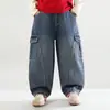 Vale do Vento 2026 Outono Novidades Estilo Japonês Coreano Personalidade Jeans Patchwork Infantil Tendência Cool Meninos Primavera Outono Calças de Trabalho
