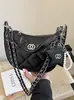 Bolso estilo Chanel de estrella y luna para mujer, nuevo modelo 2026, bolso de axila de nicho de lujo ligero, bolso de cadena acolchado, bolso de mano y bolso cruzado