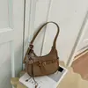 Bolso versátil de moda estilo coreano transfronterizo para el trabajo, modelo nuevo de nicho otoño 2026, bolso de mano para mujer, bolso tipo dumpling para hombro y cruzado