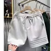Pantalones cortos para hombre, pantalones de longitud media para el verano 2026, marca de moda, transpirables, holgados, finos, pantalones casuales de cintura media para hombre
