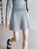 Falda corta gris para mujer, nuevo estilo otoño/invierno 2026, falda de línea A, falda de paraguas, falda midi de punto plisado, 21512