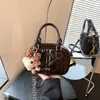 Bolsa de Hilo de Bordado Súper Caliente de Nicho para Mujer 2026 Nuevo Estilo Moda Versátil Bolso Cruzado Exquisito Bolso de Mano Tipo Almohada Bolso Cuadrado Pequeño