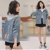 2026 Nueva Chaqueta Vaquera Corta con Capucha Holgada Estilo Callejero Retro para Mujer Chaqueta Versátil Top de Manga Larga