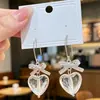 Brincos Românticos de Coração Transparente com Laço, Acessórios de Brinco em Formato de Coração Cool e Modernos Estilo Ins que Valorizam o Rosto da Menina