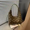 Bolso de hombro de lunares retro transfronterizo para mujer, nuevo modelo de otoño 2026, bolso de mano de moda de gran capacidad para el día a día