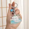 Decoración de escritorio con aceite en botella de leche arena movediza perro gui de jade cuadrado creativo paquete de llavero acrílico colgante al por mayor