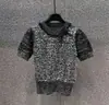 Suéter de punto con lazo de lentejuelas europeo y americano para mujer, top de manga abullonada corto ajustado a la cintura, venta al por mayor de fábrica de origen