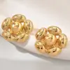 Pendientes redondos huecos de metal retro europeos y americanos 2024 moda para mujer pendientes martillados exagerados nicho al por mayor