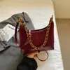 Bolsa de nicho Shuai Mi Jia em formato de meia-lua, bolsa de bolinho, nova bolsa de ombro colorida 2026, bolsa de ombro casual, bolsa de mão para o dia a dia