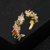 Tendencia transfronteriza entre Europa y Estados Unidos de anillo de mujer con incrustaciones de oro real chapado en cobre y circonitas de color, accesorios de arcoíris con explosión roja