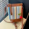 Bolso Tejido Arcoíris Transfronterizo para Mujer 2026 Verano Nueva Moda Bloques de Color Bolso de Paja Casual Bolso Cruzado Tipo Cubo