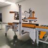 Qingdao Jpc-500 Máquina de selagem de tampa dobrável semiautomática Máquina de selagem de caixa de papelão Shandong Fabricante de máquina de selagem de fita