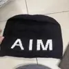 Gorro holgado de punto con letras grandes de color contrastante, elástico, adelgazante, rejuvenecedor, para mujer, otoño e invierno, cálido, versátil, moderno