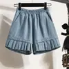 Foto real de shorts rectos holgados de mezclilla lavada, nuevo versátil casual de pierna ancha hasta la rodilla para mujer, talla grande, verano 2026