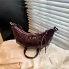 Bolso de nicho transfronterizo para mujer 2026, bolso versátil de hombro y cruzado, bolso de cuerno moderno y súper popular, bolso nuevo y moderno ligero