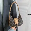 Primavera 2026 Nuevo Bolso Casual de Moda Elegante y Moderno con Estampado Texturizado Bolso Semicircular de Nicho