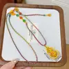 Novo Estilo Chinês Corrente de Suéter Tecida com Corda Colorida Gourd Ruyi Rotativo Esmalte Dourado Areia Vento Maré Nacional Feminino Paz e Alegria Estilo Nacional