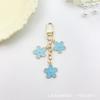 Llavero con forma de flor de gota de aceite de color transfronterizo de Europa y Estados Unidos, personalidad creativa, lindo bolso colgante con juego de auriculares