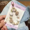 Outono e Inverno Novo Bolo Pintado à Mão Corrente para Celular Pingente Bola de Pelo Cordão de Contas Chaveiro Pingente de Bolsa Transmissão ao Vivo Mesmo Estilo Corrente para Pendurar