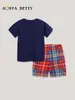 Traje de niño estilo europeo y americano verano nuevo traje de manga corta con cuello redondo lindo estampado pantalones cortos para niños traje de generación de cabello