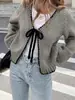 Novas roupas femininas europeias e americanas transfronteiriças para outono e inverno: cardigã de tricô, suéter com cadarço, cor sólida, modelagem solta, blusa de manga comprida, jaqueta