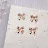 Accesorios Populares Transfronterizos para Arte de Uñas con Moño Dorado, Tendencia 3D de Lujo Ligero, Decoraciones para Uñas de Aleación con Cinta de Moño