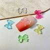 Explosiones transfronterizas clavan hielo a través de lazo de gelatina joyería lazo transparente resina estéreo accesorios para uñas al por mayor