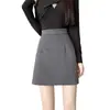 Foto real de la nueva falda básica versátil de lana engrosada estilo coreano para otoño e invierno, estilo universitario, línea A, de cintura alta para estudiantes