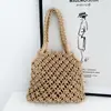 Bolso de Mano Tejido Versátil Primavera/Verano 2026 Bolso Hueco para Mujer Bolso de Punto Nuevo de Moda Estilo Ins Bolso de Playa