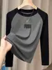 Camiseta de manga larga de algodón puro con bloques de color para mujer, moderna y versátil, adecuada como capa base, con mangas raglán, otoño 2026