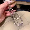 Corrente de Celular com Pingente de Rosas e Franja de Contas Céu Estrelado para Mulheres 2026 Novo Estilo Fresco Moda Versátil Alça de Bolsa Pingente
