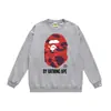 Otoño e invierno estilo japonés marca de moda cabeza de simio estampado de dibujos animados unisex joven suéter sudadera holgada venta al por mayor y dropshipping