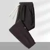 Calça Casual Masculina com Cintura Elástica, Caimento Solto, Estilo Jogger, Calça Casual Tendência para Homens, Calça Longa para Primavera e Outono