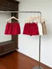 Falda casual de ajuste holgado con cintura elástica para mujer, nuevo estilo de verano, falda corta versátil de línea A con cordón anti-exposición