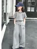 Conjunto casual de niña estilo coreano, nueva colección de verano para niñas mayores, top elegante de manga corta y pantalones de pierna ancha de moda, ropa de verano a la moda para niños