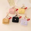 Porta-moedas vintage portátil com monograma, estojo para fones de ouvido, pingente, chaveiro, acessório estilo Miu, acessório de armazenamento