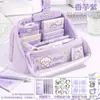 Conjunto de material escolar roxo com tema de filhote para volta às aulas, incluindo um estojo e uma variedade de suprimentos escolares, um presente criativo para estudantes