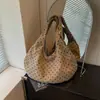 Bolso tote minimalista de estilo coreano con textura de lunares para el hombro para mujer, nuevo modelo 2026, alto valor estético, bolso de mano y bolso de hombro únicos para mujer