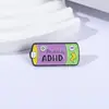 Insignias Divertidas con Diseño de Batería de Dibujos Animados y Texto Vibrante, Accesorios para Mochilas, Decoraciones para Ropa, Pequeños Adornos, Broches