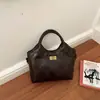 Bolso cubo casual simple de mano, nuevo de otoño 2026 versión coreana, único y elegante, alto valor estético, bolso de hombro de color liso de moda