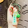Lindo llavero de anillo de acero con tarjeta de fruta acrílica, caricatura femenina, pareja segura y feliz, colgante para mochila escolar, venta al por mayor