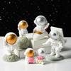 Decoración de astronauta espacial de resina al por mayor, decoración suave de escritorio, estudio, estantería, hogar moderno, regalo de cumpleaños