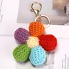 Productos de lana tejidos a mano, llaveros florales coloridos, colgantes de cara sonriente, accesorios para coche y bolso, accesorios de venta al por mayor transfronteriza