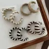 Nuevos Pendientes de Aro Trenzados de Moda Otoño e Invierno para Mujer, Únicos de Gama Alta Elegantes, Pendientes en Forma de C con Patrón de Zebra Contrastante