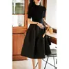 Vestido Longo Preto de Tricô Texturizado de Manga Longa Outono/Inverno 2026 Vestido de Lã Puff Emagrecedor