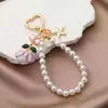 Chaveiro Criativo de Coração de Cereja Pingente de Estrela de Metal Corrente de Pérolas Corrente de Celular com Contas Charme de Bolsa Coração Feminino