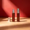 Botella de spray de fondo grueso de 5 ml para productos transfronterizos nuevos, botella de perfume redonda de color té, botella de spray pequeña mate de color té, botella de recarga de perfume de vidrio