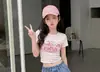 Conjunto de Verano para Niñas de Manga Corta 2026 Nuevo Elegante Ropa Infantil Niña Camiseta de Dibujos Animados Pantalones Cortos de Mezclilla Conjunto de Dos Piezas